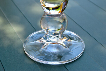 Base of Clear Glass on Wooden Table in Close Up