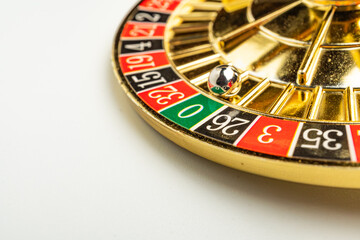 Close-up image of a spinning roulette wheel with numbers 1-36, odd and even, single zero in green Blurred background