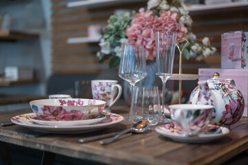 Close up on luxury italian tableware, dishes and glasses.