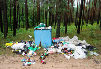 Garbage dump on recreation area. Throw garbage in forest after spending time. Trash at camping resort. Environmental pollution. Illegal dumping of Garbage. Overflowing trash container, garbage removal