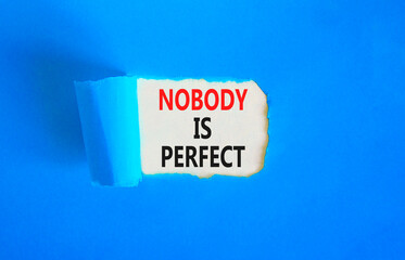 Nobody is perfect symbol. Concept words Nobody is perfect on beautiful white paper. Beautiful blue paper background. Business motivational lifestyle and nobody is perfect concept. Copy space.