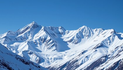 Obraz premium Icy Mountain Peaks A majestic mountain range with glistening icy peaks and a clear blue sky, evoking a sense of serenity.