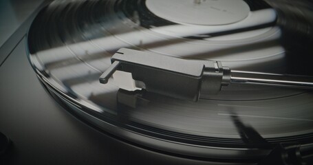 Vinyl Record Rotating On Retro Turntable. Stylus Needle Touching Grooves, Playing Sound on Vinyl...