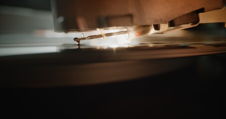 Macro Close Up of Stylus Needle Touching Grooves, Playing Song on Vinyl Record Player. Vinyl Record...