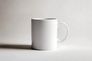 Obraz premium A pristine white ceramic mug sits in a simple studio environment