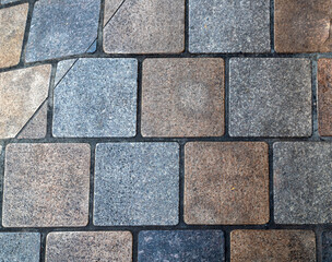 Stone Cube Roadway with Pastel Blue and Red Faded Tiles.
