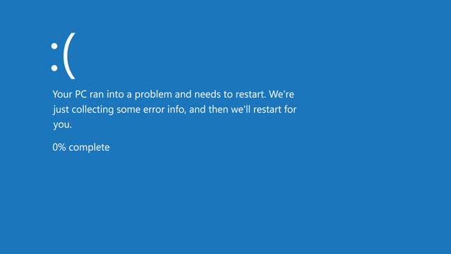 Blue screen error with sad face and restart message