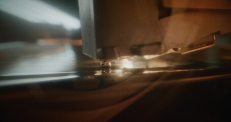 Retro Sound System with Nostalgic Aesthetic: Macro Close Up of Needle Gently Scratching Grooves, Playing Music or Analog Sound on Vinyl Record Player. Vinyl Record Spinning On Vintage Turntable.