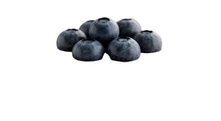 A close up shot of a small pile of fresh blueberries on a black background with a soft light source