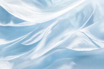 Naklejka premium An abstract image of light blue feathers gently resting on a smooth background, with soft shadows casting across the delicate textures of the feathers. The light creates a subtle gradient effect