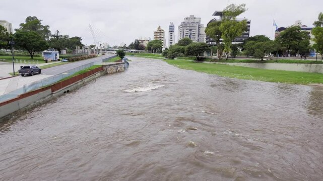 Cordoba, Argentina - 03.26.2025: View of the embankment in the center of Cordoba. The rapid flow of the Rio Primero River, under the Indian name of Sukiya.
