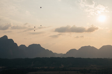 Laos, Vang Vieng, Serene Sunset Over Majestic Mountains and a Peaceful Valley, A Spectacular Sight