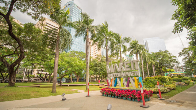 MANILA, PHILIPPINES - NOVEMBER 28, 2017: Ayala Triangle in Makati City, Metro Manila, Philippines. Metro Manila is one of the biggest urban areas in the world with 24 million people.