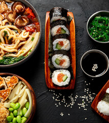Traditional Japanese food dishes served on the table.
