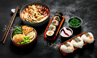 Traditional Japanese food dishes served on the table.