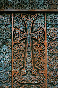 ancient stone cross with openwork relief, traditional ornate Armenian. medieval cross khachkar, carved on gravestone. symbol of ortxodox church, faith in God