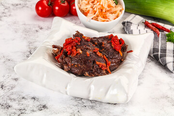 Baked beef cheeks with vegetables