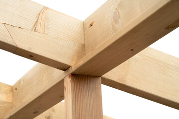 Making a wooden roof. Close-up wooden roof trusses in a frame structure. Steel beam connections. Wooden roof structure