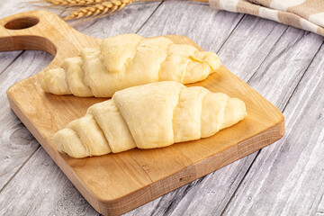 Raw uncooked croissant for bake