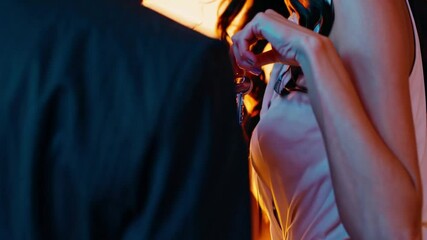 Two friends share a joyful moment during a celebration, surrounded by bright colors and warm ambiance. Their laughter echoes happiness as they embrace new adventures together