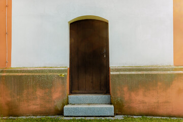 Back door of the church of St Sebastian in the Bavarian town of Puch near Munich in Germany © were