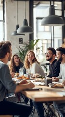 A group of friends sitting around a long table laughing