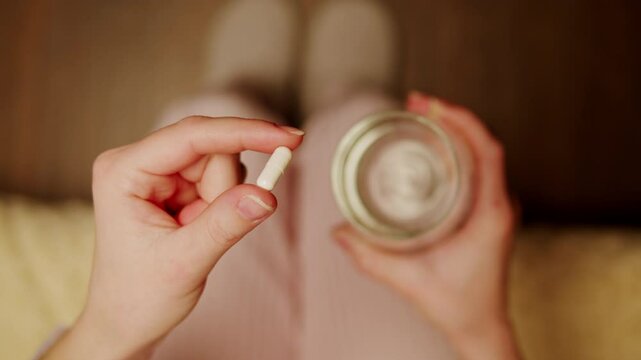 Pills and vitamins macro, Close up view of womans hands holding plenty of different drugs. Painkillers and antibiotics. Healthcare and medicine concept