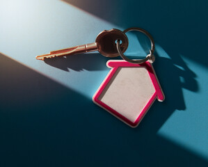 House and key on blue background.
