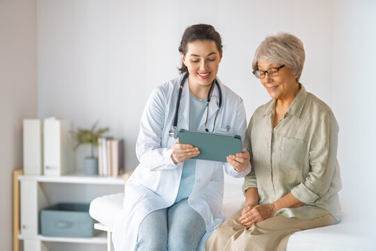 patient with a doctor in medical office