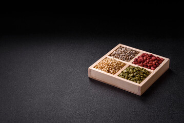 A box of peanuts and cedar nuts and sunflower and pumpkin seeds