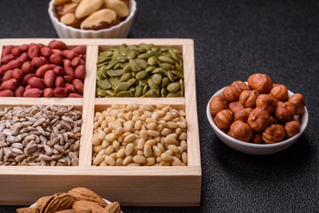 A box of peanuts and cedar nuts and sunflower and pumpkin seeds