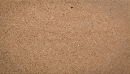  A high-resolution close-up of old brown recycled cardboard paper texture. The surface appears rough and fibrous, with visible fibers, creases, and subtle imperfections. It has earthy, neutral toneS
