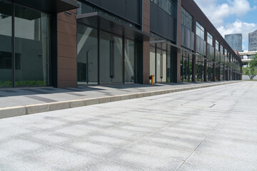 empty concrete ground in front of modern office buildings in downtown. floor for copy space
