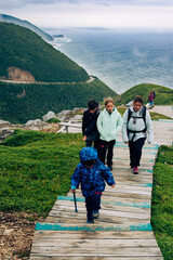 Family walking the Skyline Trailhead, Cabot trail, Cape Berton Island, Nova Scotia, Canada