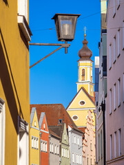 Charming Colorful Street with Church Steeple in medieval town of Landshut, Bavaria