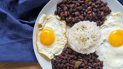 Beans with rice and egg. Typical food from the Caribbean, many parts of Latin America and Sephardic communities.