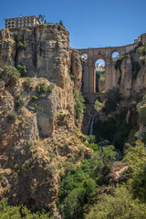 Vertical Landscape of Puente Nuevo in Ronda. Beautiful Town on Rock and Bridge during Sunny Day in Spain. Outdoor Andalusian Scenery in Province of Málaga.