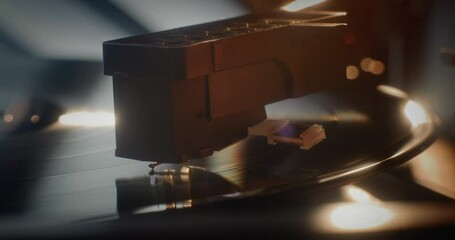 Macro Close Up of Needle Gently Scratching Grooves, Playing Song or Authentic Analog Music on Vinyl Record Player. Vinyl Record Spinning On Vintage Turntable. Retro Sound System with Nostalgic Vibe.