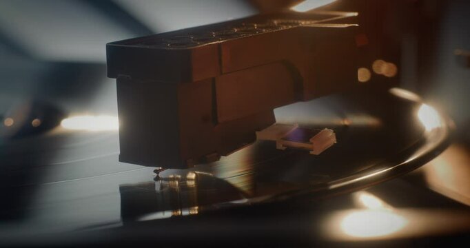 Macro Close Up of Needle Gently Scratching Grooves, Playing Song or Authentic Analog Music on Vinyl Record Player. Vinyl Record Spinning On Vintage Turntable. Retro Sound System with Nostalgic Vibe.