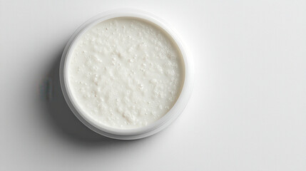 minimalist product mockup of white jar containing textured cream or scrub
