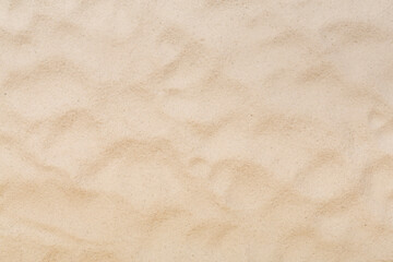Textured beach sand as background, top view