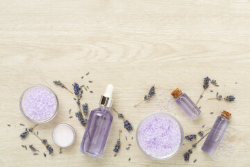 Lavender spa cosmetic on wooden background, top view