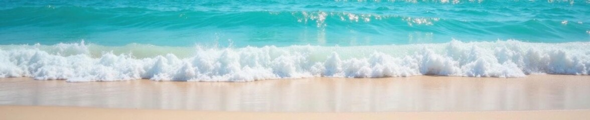 Soft blue ocean waves gently rolling onto a pristine sandy beach at low tide, horizon, calm, blue