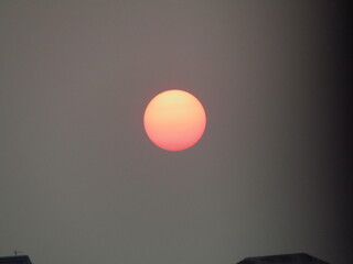 Sunset in the sky, red and orange, closeup of photo