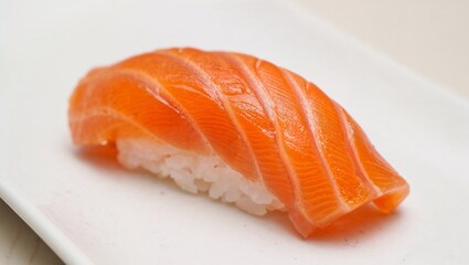 Close-up of fresh salmon nigiri sushi on white plate, traditional Japanese cuisine
