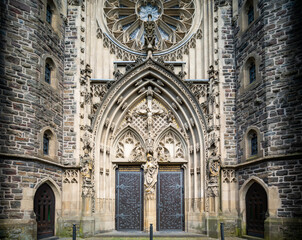 The historic St. Martinus Church in Olpe, Germany, built in neo-Gothic style, features a striking 61-meter tower and intricate architectural details, standing as a cultural landmark.