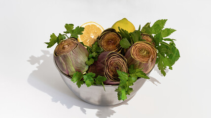  Artichokes in a bowl on white background.