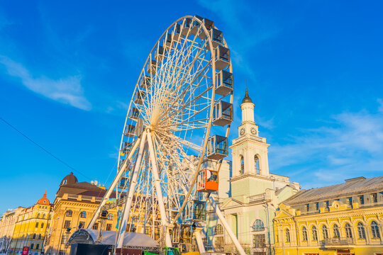 Kyiv, Ukraine - March 28, 2025: Panoramic View of Kontraktova Square Ferris Wheel in Kyiv