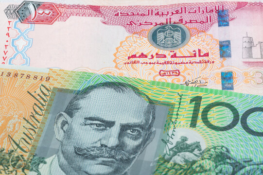 100 United Arab Emirates dirham and 100 Australian dollar banknotes. International trade concept