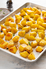 Oven roasted potatoes on a sheet pan cooked with herbs and spices